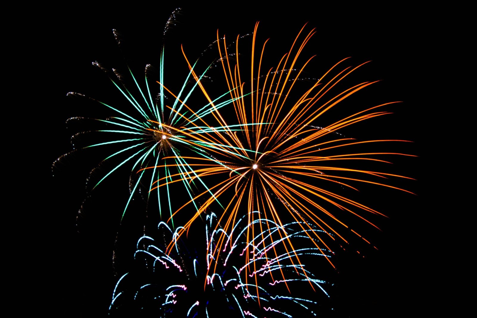 Several firework explode in the sky